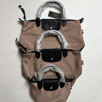 Unisex torba od prave kože u obliku dumplinga sa flap zatvaračem, velika kapaciteta; unutarnji džepovi za telefon, dokumente, laptop i kameru