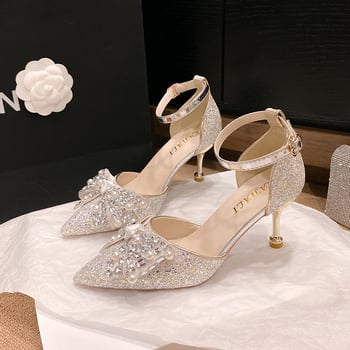 Νυφικά ψηλά παπούτσια με σαμπανιζέ παγιέτες και φιόγκο, μυτερό δάχτυλο, βελούδινο επάνω μέρος, ύψος τακουνιού 6-8 cm, κούμπωμα με αγκράφα, συνθετική σόλα