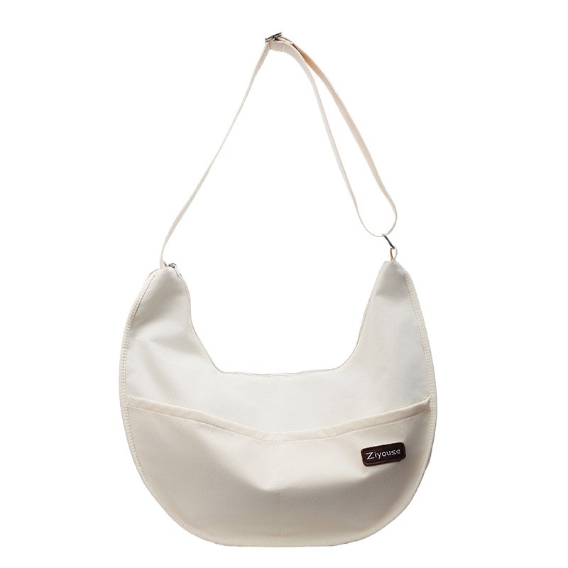 Crossbody torba dumpling – gradska jednostavnost, PU materijal, oblik dumpling, zatvarač, unutarnja pretinica za telefon