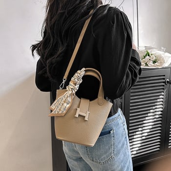 Ženska bucket torba, PU koža, gradski minimalizam, zatvarač na zip, unutarnji džep