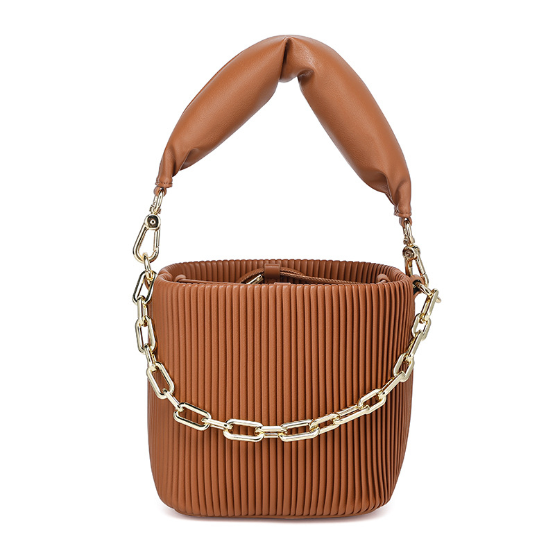 Ženska bucket bag od prave kože, kompaktna, s šnôrovým otvaranjem; unutarnji pretinci za telefon, osobnu iskaznicu i džep sa zipom; svakodnevna uporaba, s jednim naramenicom