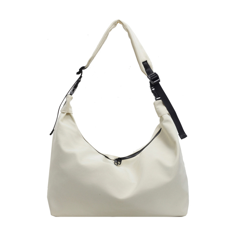 Crossbody torba od Oxford platna, oblik knedle, zatvarač, unutarnji džep sa zatvaračem i džep za telefon, gradski stil