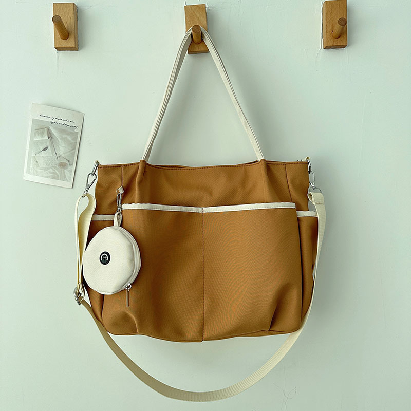 Torba Tote: Oxford platno, zatvarač, poliester podstava, horizontalni kvadratni oblik, tri naramenice