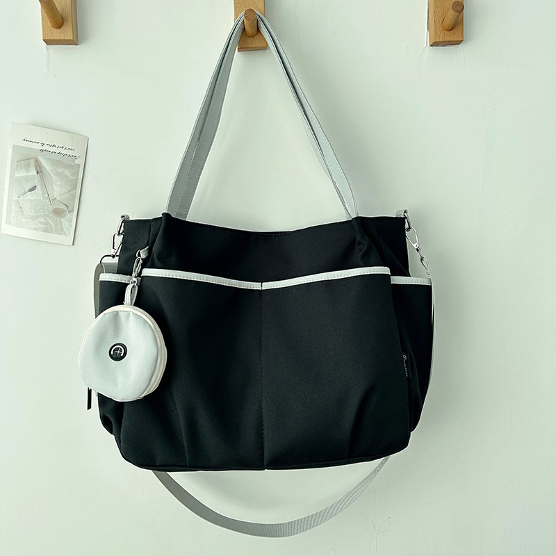 Torba Tote: Oxford platno, zatvarač, poliester podstava, horizontalni kvadratni oblik, tri naramenice