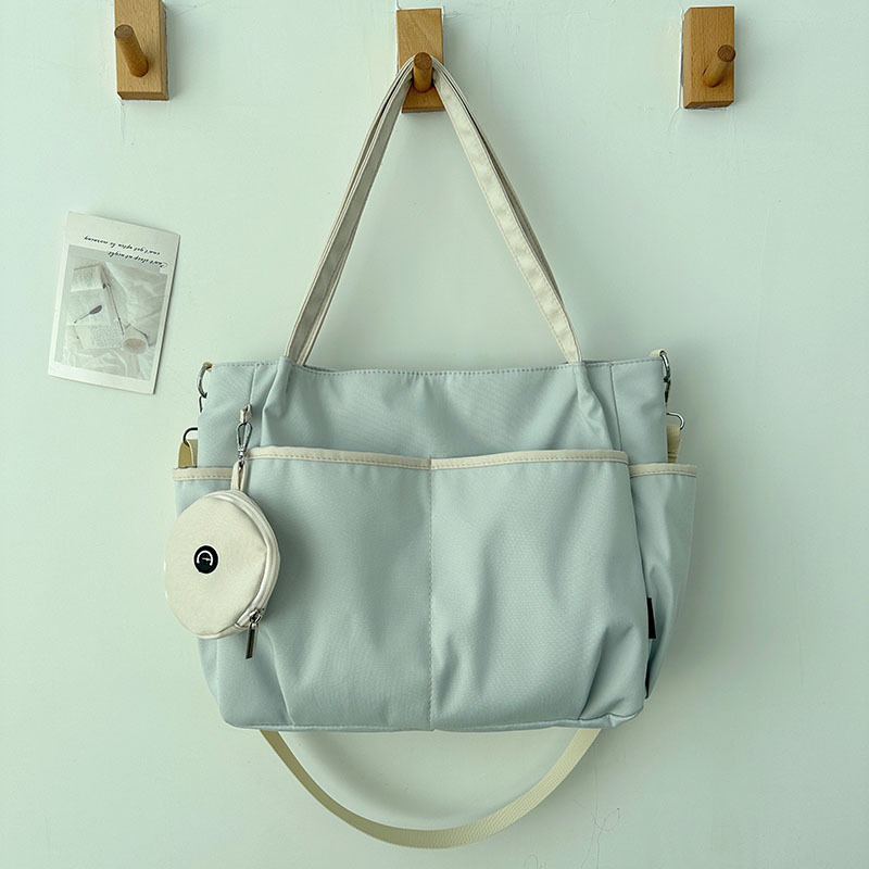 Torba Tote: Oxford platno, zatvarač, poliester podstava, horizontalni kvadratni oblik, tri naramenice