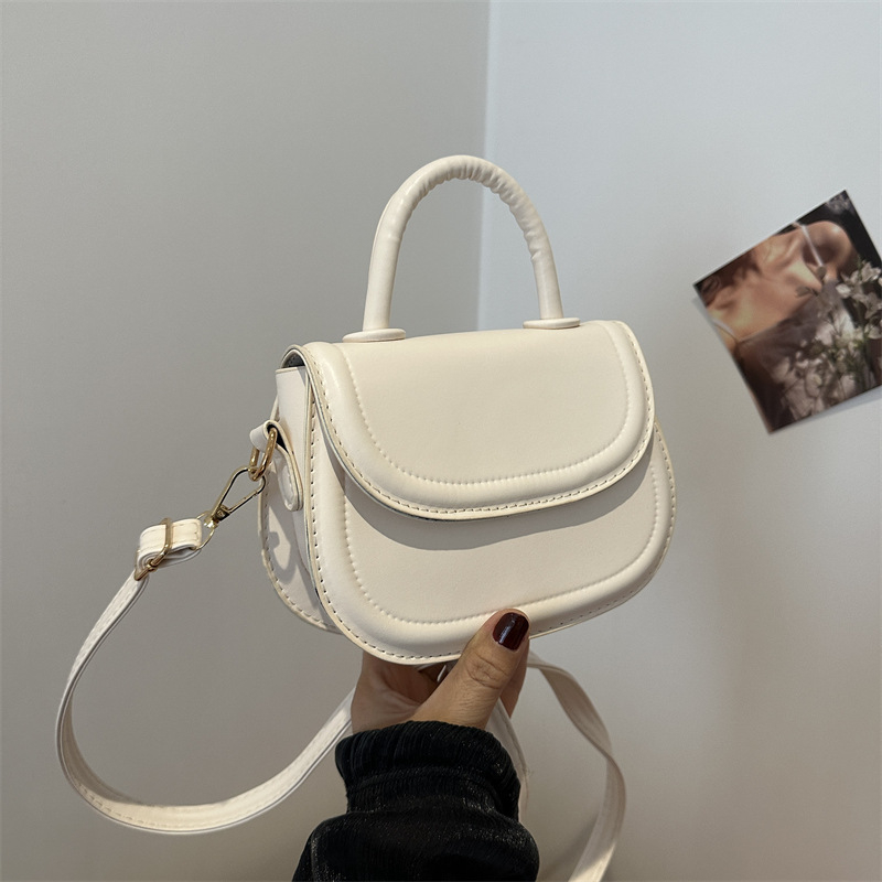 Crossbody torba (urbana jednostavnost) — PU materijal, mala kvadratna torba stil, ovalni oblik, otvaranje poklopcem, džep za prijenosno računalo