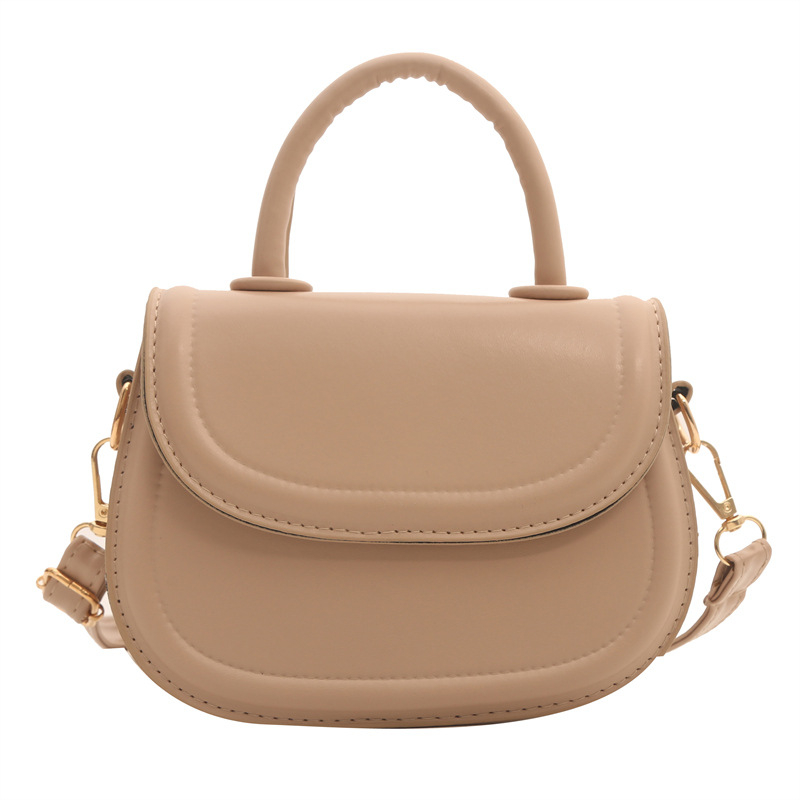 Crossbody torba (urbana jednostavnost) — PU materijal, mala kvadratna torba stil, ovalni oblik, otvaranje poklopcem, džep za prijenosno računalo