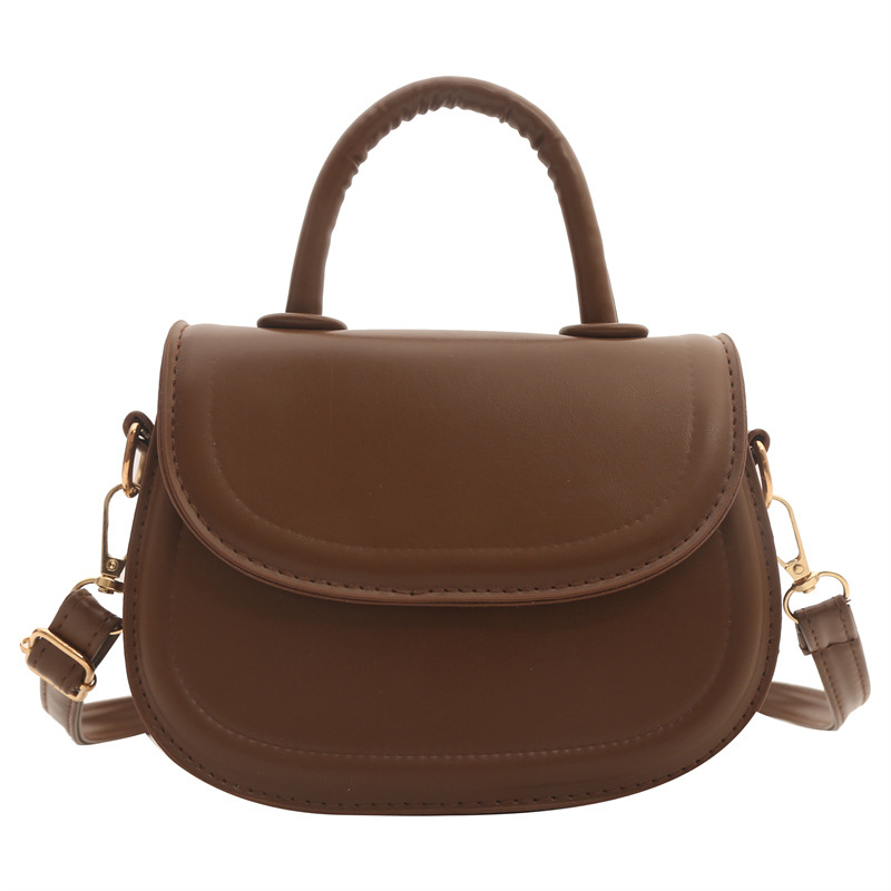 Crossbody torba (urbana jednostavnost) — PU materijal, mala kvadratna torba stil, ovalni oblik, otvaranje poklopcem, džep za prijenosno računalo