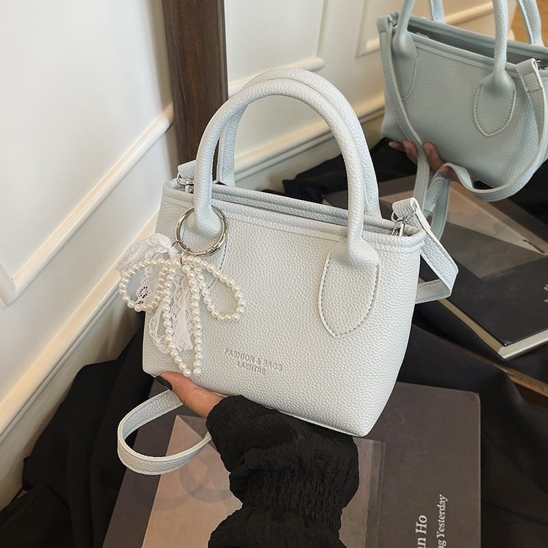 Ženska crossbody bucket torba (PU materijal, street-trend stil, zatvaranje na zip, podstava od poliester, džep za mobitel)