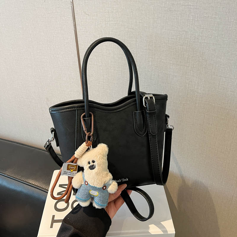 Geantă bucket din PU, stil urban minimalist, închidere magnetică, curea simplă, buzunar pentru telefon, primăvara 2026