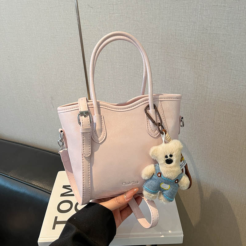 Geantă bucket din PU, stil urban minimalist, închidere magnetică, curea simplă, buzunar pentru telefon, primăvara 2026