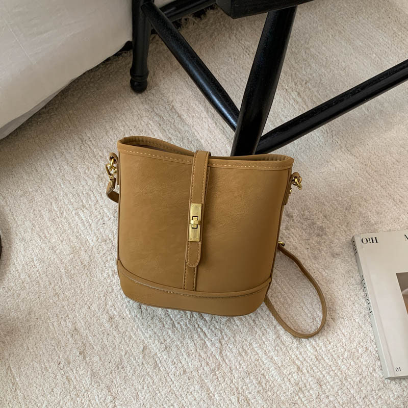 Gradskim minimalističkim PU crossbody bucket torba za žene — zatvarač, skriveni džep, podstava od poliestera, pravokutnog oblika, proljeće 2026