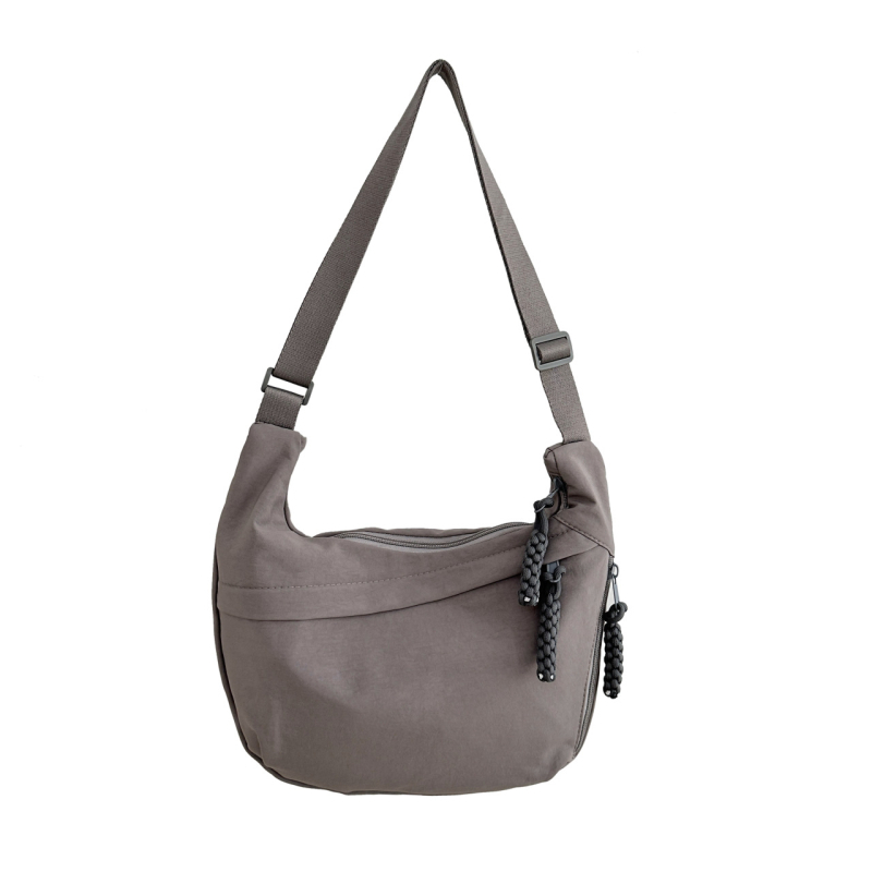Crossbody torba u obliku dumplinga, gradski stil, kompozitni materijal, zatvaranje na zip, poliester podstava
