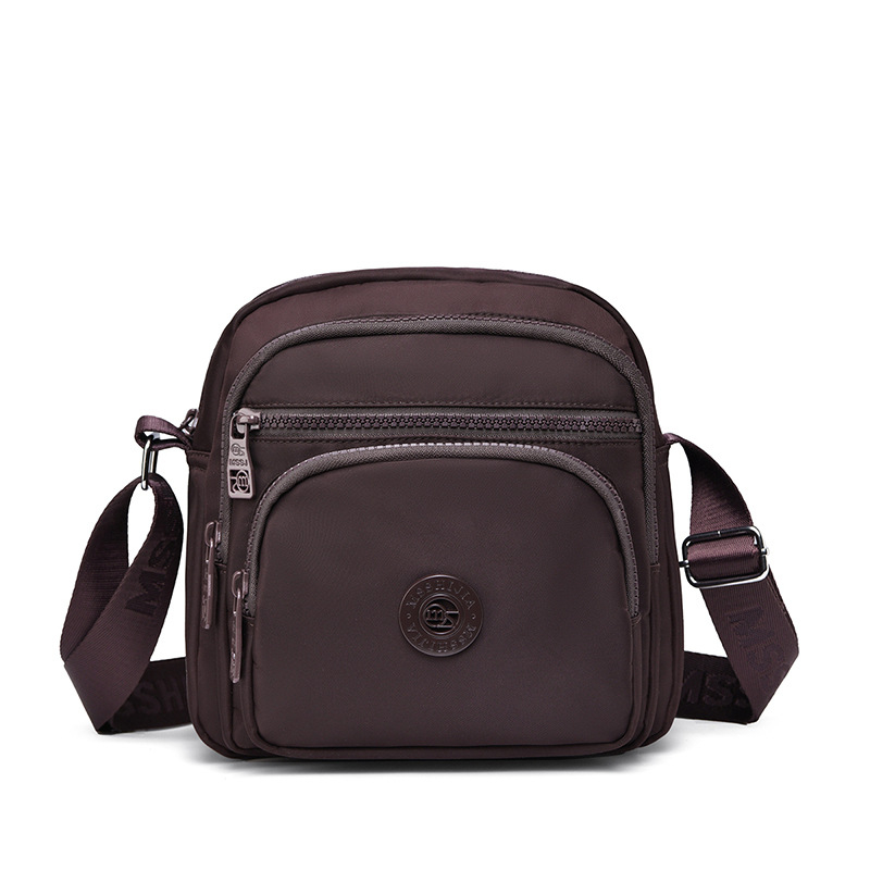 Damska crossbody torba od Oxford platna, vertikalno kvadratnog oblika, zatvarač, unutarnji pretinci: pretinac sa zatvaračem, pretinac za telefon, pretinac za dokumente, podstava od pamuka