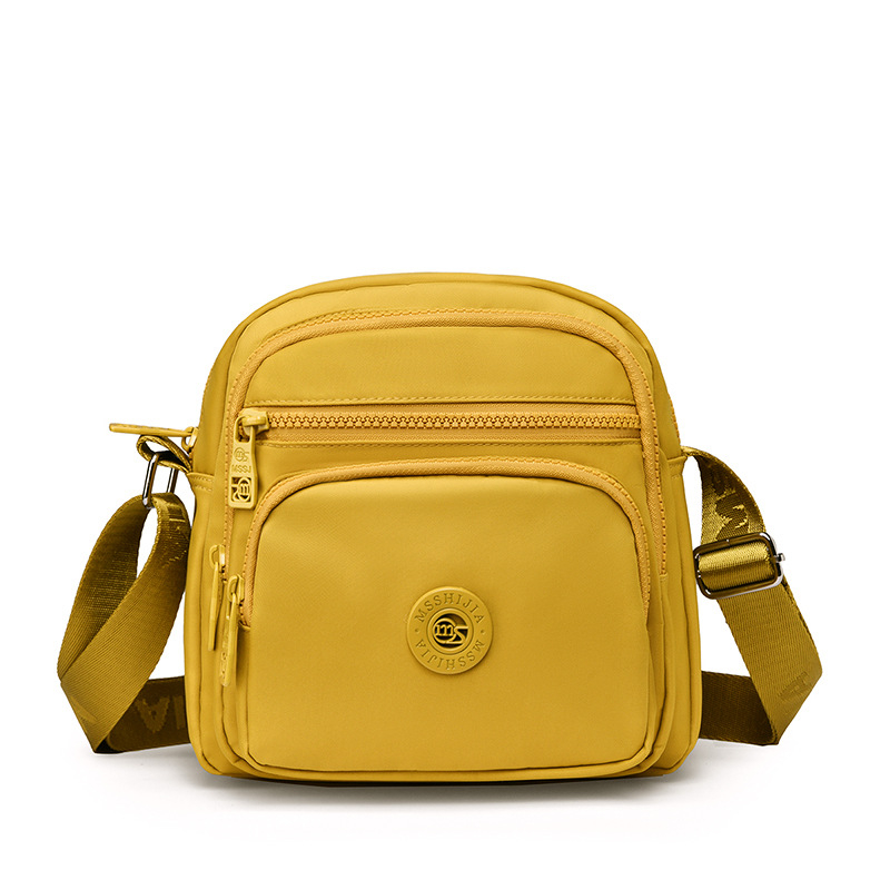 Damska crossbody torba od Oxford platna, vertikalno kvadratnog oblika, zatvarač, unutarnji pretinci: pretinac sa zatvaračem, pretinac za telefon, pretinac za dokumente, podstava od pamuka