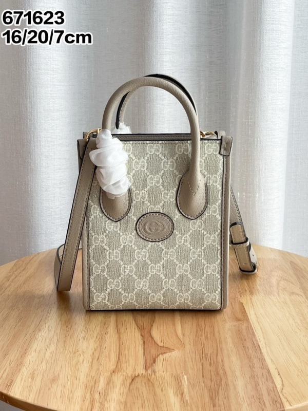 G-brand kožna retro tote torba za partituru – monogram uzorak (Materijal: prava koža; Podstava: platno; Oblik: uspravni kvadrat; Remenje: dvostruka; ID pretinac)