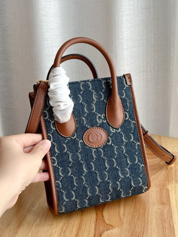 G-brand kožna retro tote torba za partituru – monogram uzorak (Materijal: prava koža; Podstava: platno; Oblik: uspravni kvadrat; Remenje: dvostruka; ID pretinac)