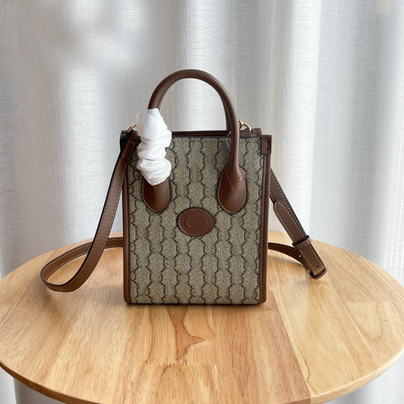 G-brand kožna retro tote torba za partituru – monogram uzorak (Materijal: prava koža; Podstava: platno; Oblik: uspravni kvadrat; Remenje: dvostruka; ID pretinac)