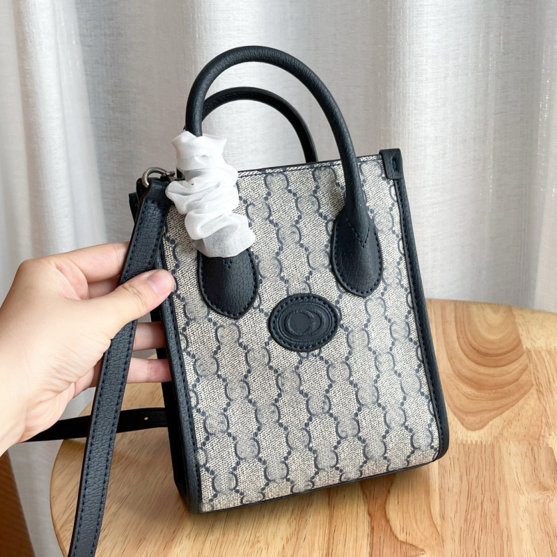 G-brand kožna retro tote torba za partituru – monogram uzorak (Materijal: prava koža; Podstava: platno; Oblik: uspravni kvadrat; Remenje: dvostruka; ID pretinac)