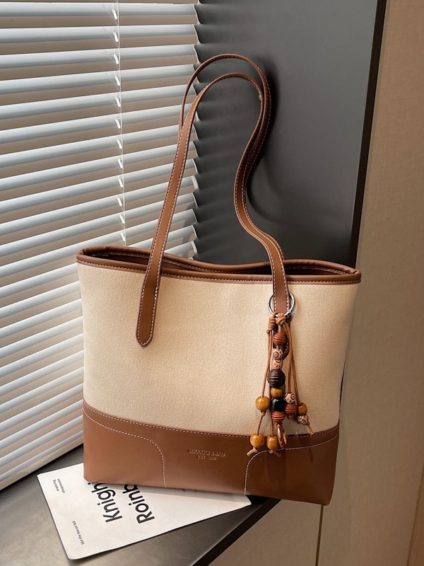 Városi minimalist stílusú PU tote táska, cipzárral nyitás, belső zsebek: rejtett cipzáras zseb és irattartó zseb, 2026 tavasz