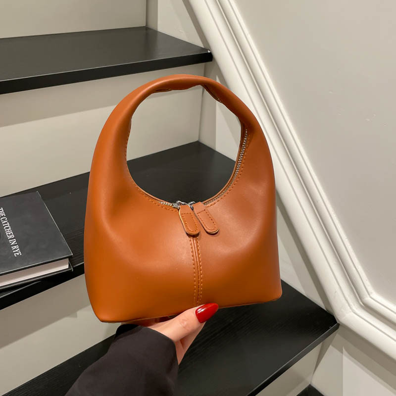 Ženska bucket torba s urbanim minimalistom, PU materijal, zatvaranje na zip, poliester podstava