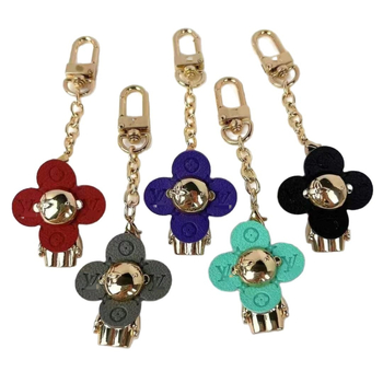 Ötvözetből készült négylevelű lóhere hátizsák medál és kulcstartó — fémdísz