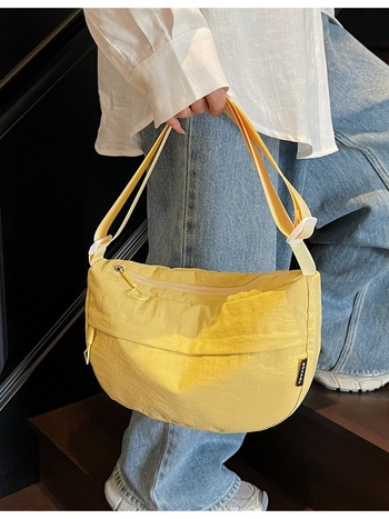 Urban minimalistička crossbody torba u obliku dumplinga od Oxford platna, s zatvaračem i džepom za telefon
