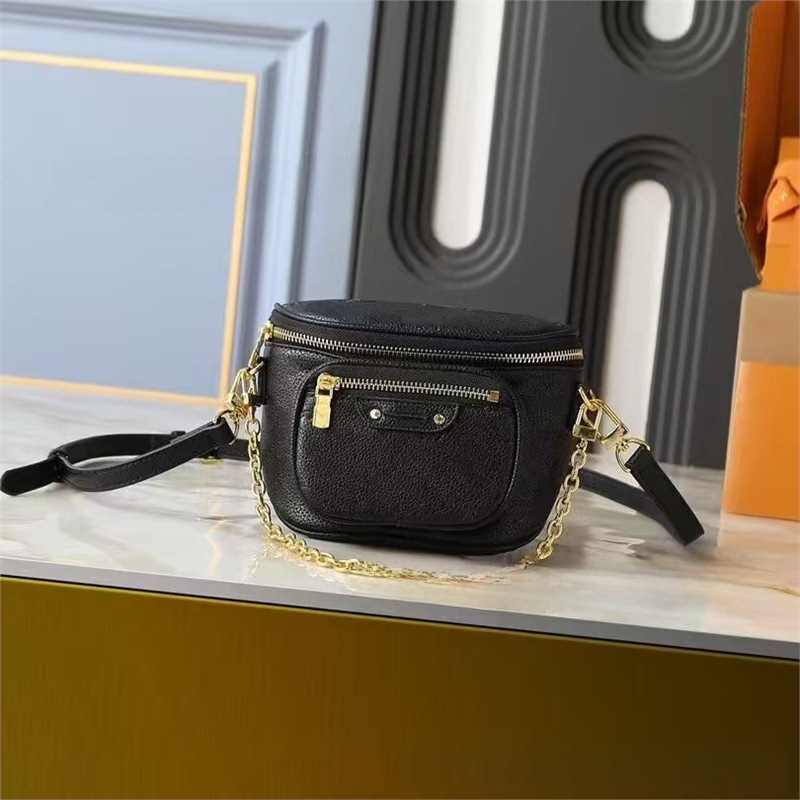 Crossbody torbica od prave kože, okruglog oblika, zatvaranje zipom, dvostruki remen