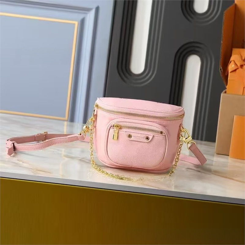 Crossbody torbica od prave kože, okruglog oblika, zatvaranje zipom, dvostruki remen