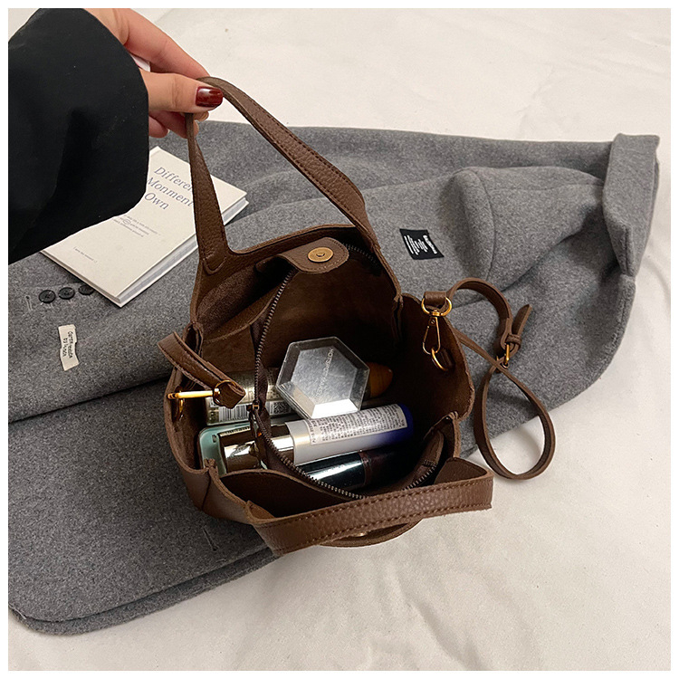 Női PU anyagú vödörtáska, városi egyszerű stílus, zipzáras záródás, belső cipzáros zseb, poliészter bélés