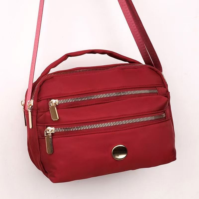 Ženska crossbody torbica u urbanom minimalističkom stilu, najlon materijal, zatvarač, proljeće 2026 (Urban minimalistički stil; Najlon; Crossbody torbica; Zatvarač; Proljeće 2026)