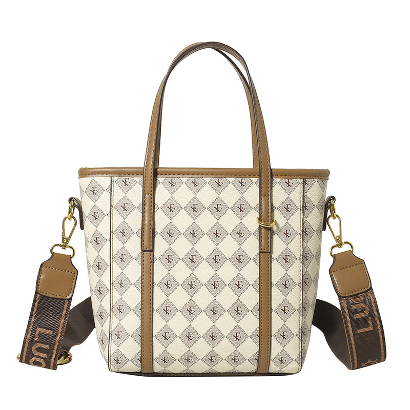 PU anyagú vödrös táska, függőleges négyszögletes sziluett, cipzáras nyitás, belső cipzáros zseb, egy vállpánt