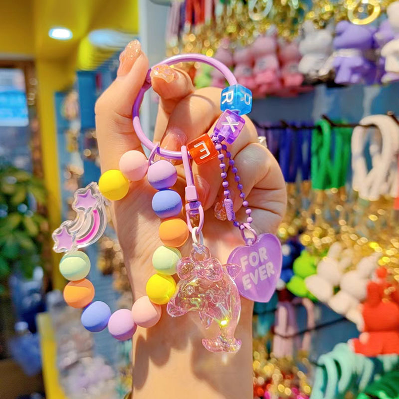 Gyantából készült kulcstartó delfin gyöngyökkel - rajzfilmszerű stílus, ideális ajándék