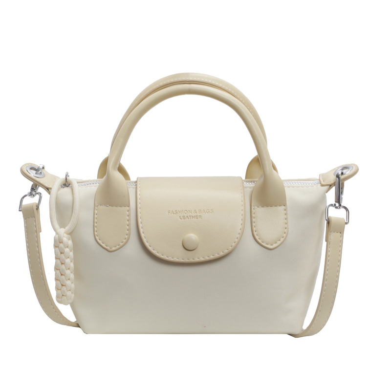Crossbody Dumpling torba — PU materijal, dumpling oblik, otvaranje kapom, podstava od poliestera, unutarnji džepovi: skriveni džep na zip i džep za telefon