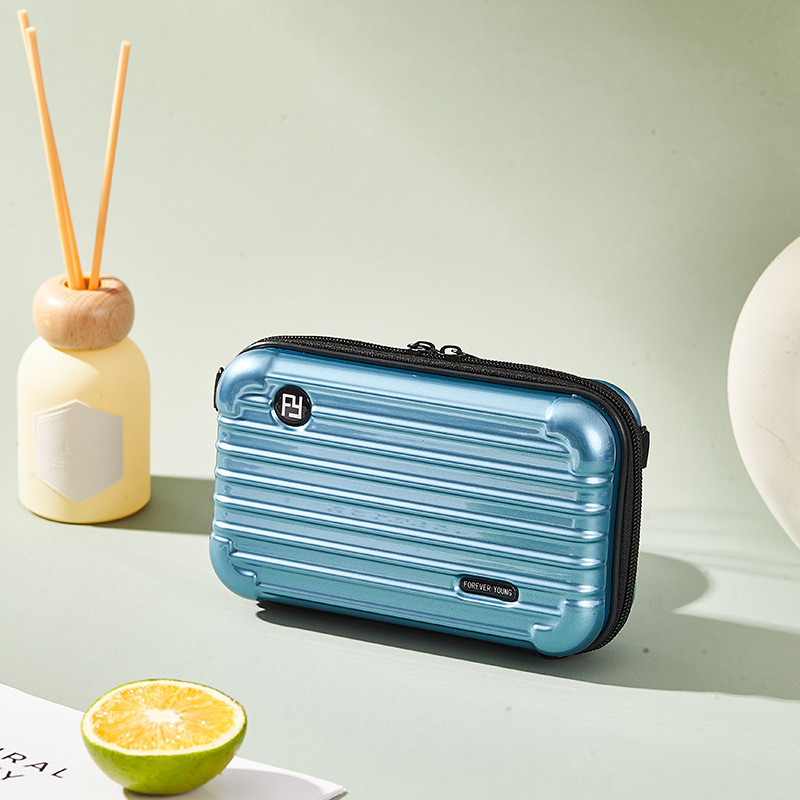 Mini PC kozmetička torbica s crossbody remenom, korejskog stila za putovanja; vanjska plastika, podstava od poliester; vodootporna, periva, višefunkcionalna; unisex.