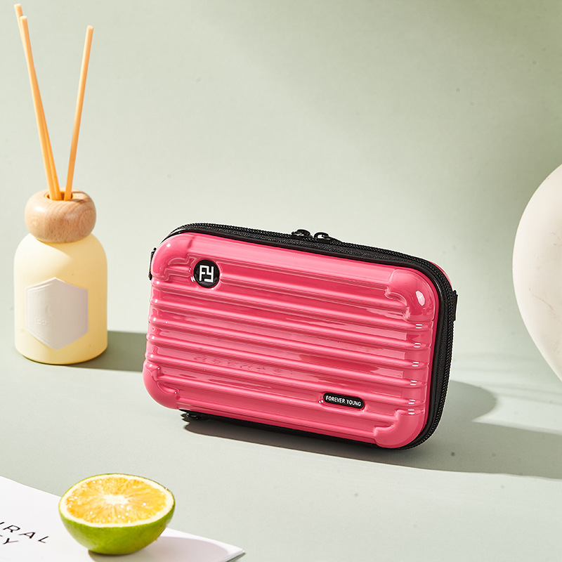 Mini PC kozmetička torbica s crossbody remenom, korejskog stila za putovanja; vanjska plastika, podstava od poliester; vodootporna, periva, višefunkcionalna; unisex.