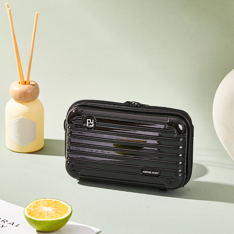 Mini PC kozmetička torbica s crossbody remenom, korejskog stila za putovanja; vanjska plastika, podstava od poliester; vodootporna, periva, višefunkcionalna; unisex.