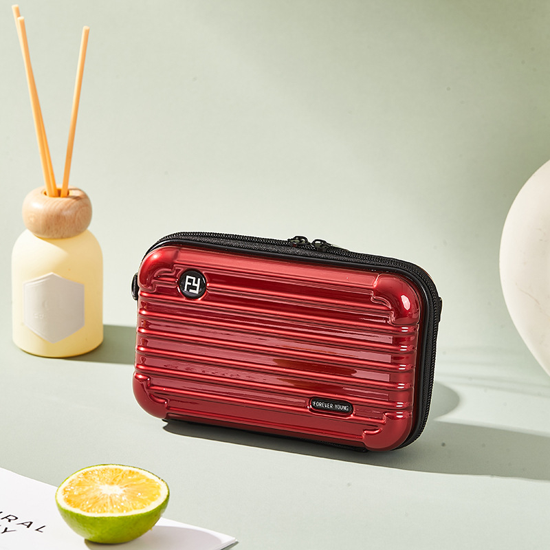 Mini PC kozmetička torbica s crossbody remenom, korejskog stila za putovanja; vanjska plastika, podstava od poliester; vodootporna, periva, višefunkcionalna; unisex.