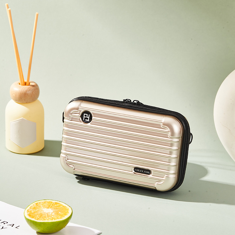 Mini PC kozmetička torbica s crossbody remenom, korejskog stila za putovanja; vanjska plastika, podstava od poliester; vodootporna, periva, višefunkcionalna; unisex.