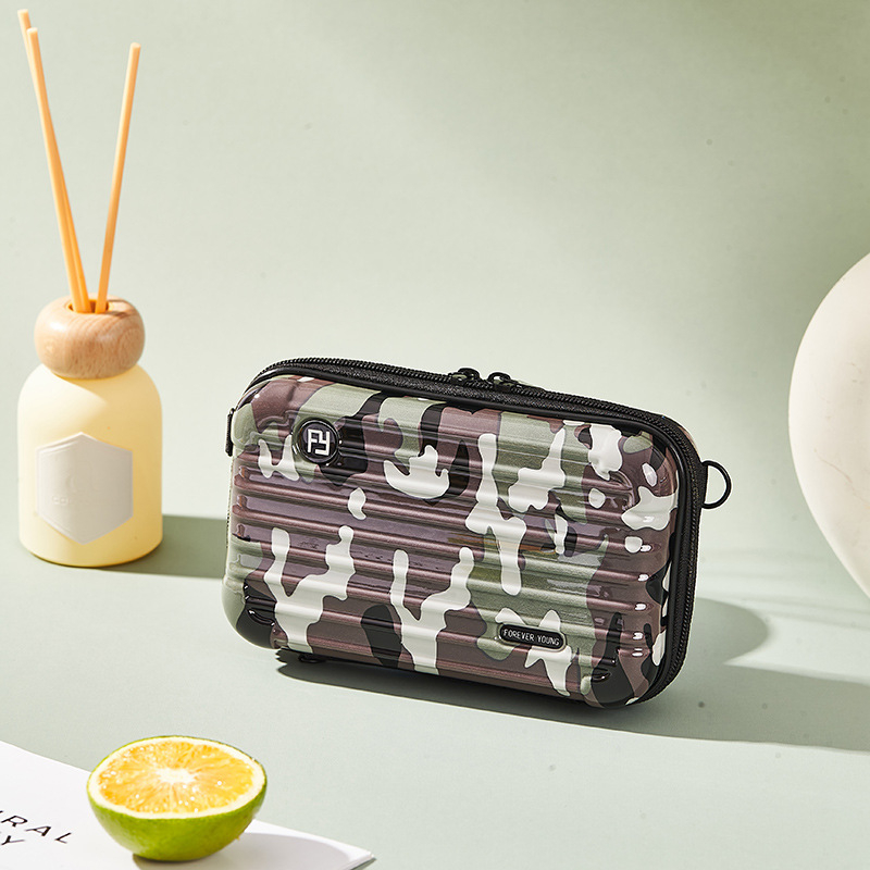 Mini PC kozmetička torbica s crossbody remenom, korejskog stila za putovanja; vanjska plastika, podstava od poliester; vodootporna, periva, višefunkcionalna; unisex.
