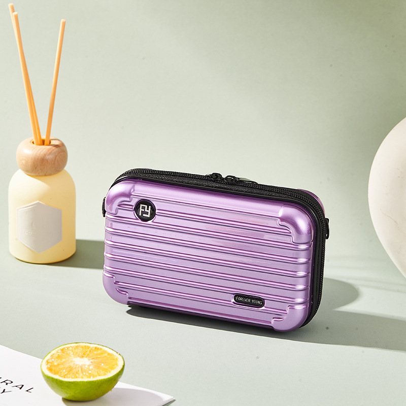 Mini PC kozmetička torbica s crossbody remenom, korejskog stila za putovanja; vanjska plastika, podstava od poliester; vodootporna, periva, višefunkcionalna; unisex.