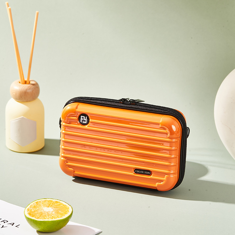 Mini PC kozmetička torbica s crossbody remenom, korejskog stila za putovanja; vanjska plastika, podstava od poliester; vodootporna, periva, višefunkcionalna; unisex.
