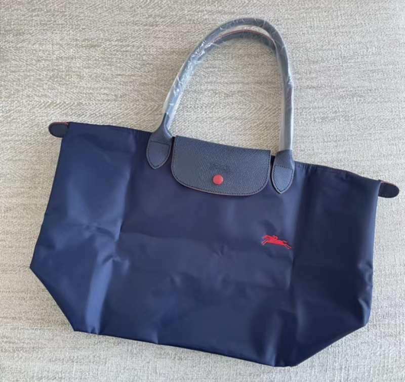 Τσάντα ώμου τύπου dumpling από Oxford ύφασμα, κλείσιμο με καπάκι, εσωτερικές θήκες για κινητό και έγγραφα, επένδυση πολυεστερική