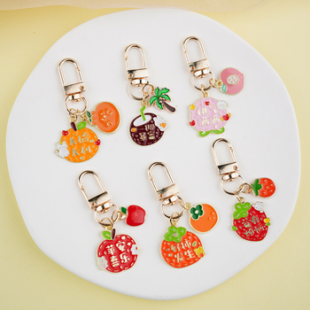 Fém kulcstartó medál – gyümölcs ihletésű szöveges dizájn és aranyos lányos karikatúra, táska kiegészítő, ajándék