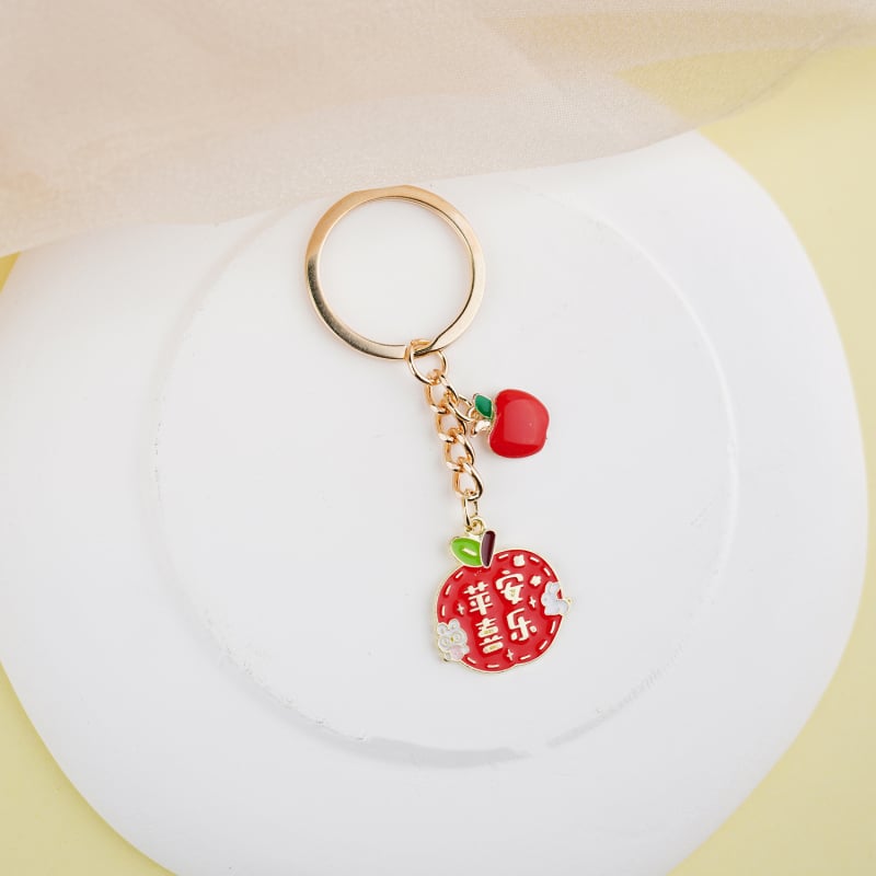 Fém kulcstartó medál – gyümölcs ihletésű szöveges dizájn és aranyos lányos karikatúra, táska kiegészítő, ajándék