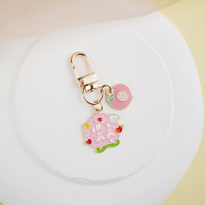 Fém kulcstartó medál – gyümölcs ihletésű szöveges dizájn és aranyos lányos karikatúra, táska kiegészítő, ajándék