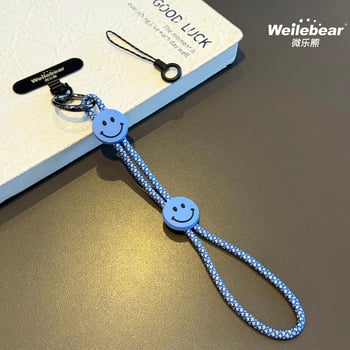 Koniec šmýkaniu! Šnúrka na telefón s usmievavou tváričkou, nastaviteľný remienok na zápästie, unisex prívesok na fotoaparát, šnúrka proti strate na vonkajšie použitie.