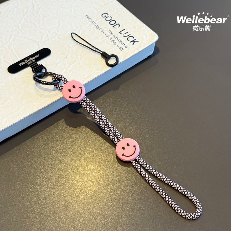 Koniec šmýkaniu! Šnúrka na telefón s usmievavou tváričkou, nastaviteľný remienok na zápästie, unisex prívesok na fotoaparát, šnúrka proti strate na vonkajšie použitie.