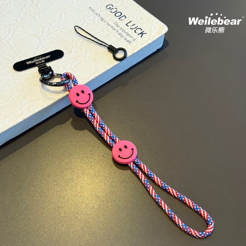 Koniec šmýkaniu! Šnúrka na telefón s usmievavou tváričkou, nastaviteľný remienok na zápästie, unisex prívesok na fotoaparát, šnúrka proti strate na vonkajšie použitie.