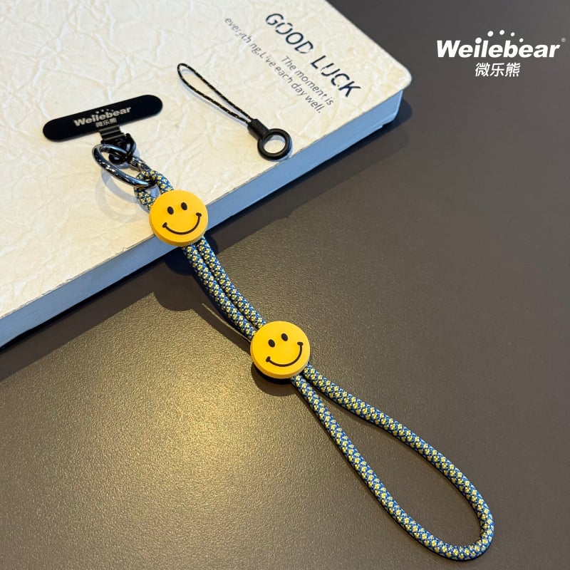 Koniec šmýkaniu! Šnúrka na telefón s usmievavou tváričkou, nastaviteľný remienok na zápästie, unisex prívesok na fotoaparát, šnúrka proti strate na vonkajšie použitie.